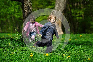 Little boy and girl running away