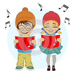 Little boy and girl singing Christmas carols