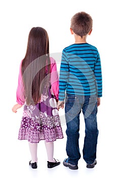 Little boy and girl standing and looking towards