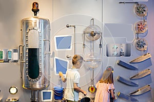 Little boy and girl visit a science museum