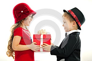 Little boy giving girl gift