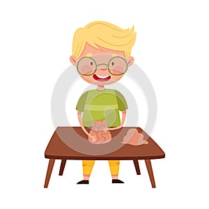 Little Boy in Glasses Standing at Table and Moulding Clay Vector Illustration