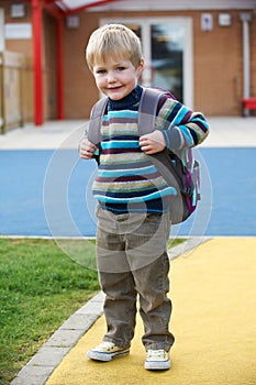 Little Boy Going To School Wearing Backpack