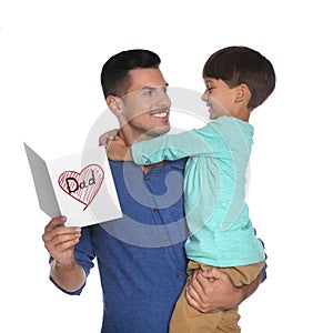 Little boy greeting his dad with Father`s Day on white background