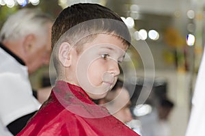 Little boy at the hair dresser