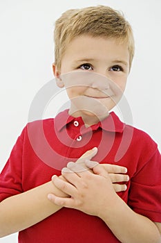 Little Boy With Hand On Heart