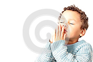 Little boy with hands together praying