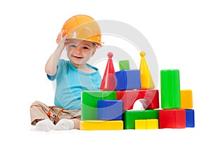 Little boy with hard hat and building blocks