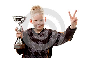 Little boy has won the second place trophy cup