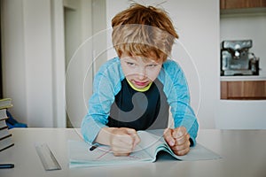 Little boy hates doing homework, stress and agreession