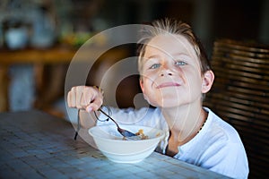 Little boy having breakfast