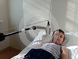 Little boy having electrotherapy in the electrotherapy cabinet.