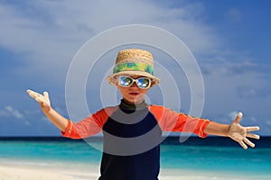 Little boy having fun on beach vacation