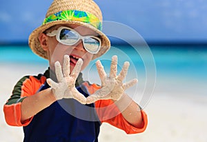 Little boy having fun on beach vacation