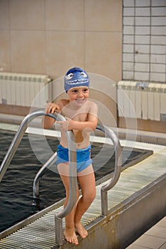 Little boy having fun at the swimming pool