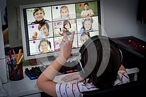 Little boy having online school distance learning class at home