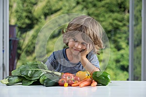 Little boy having vegetable meal
