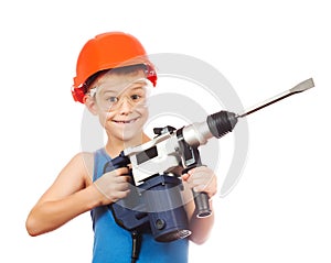 Little boy in a helmet with electric hammer