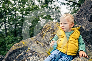 Little boy hiking in mountins