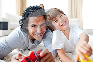 Little boy and his father playing video games