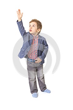 Little boy with with his hand lifted up photo
