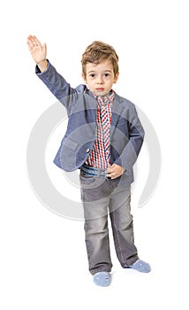 Little boy with his hand lifted up on white photo