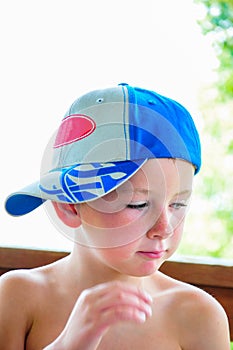 Little boy with his hat sideways