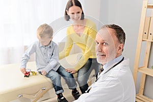 Little boy with his mother at paediatrician on consultation