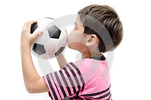 Little boy holding football sport player