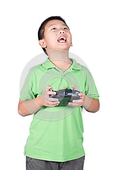 Little boy holding a radio remote control (controlling handset) for helicopter , drone or plane Isolated