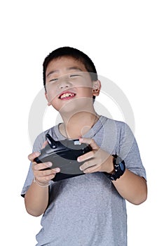 Little boy holding a radio remote control for helicopter, drone