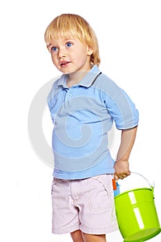 Little boy holding two buckets