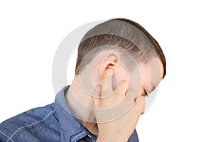 Little boy holds on to the ear, part of the face close-up, medical concept, hearing control, middle ear inflammation, otitis media