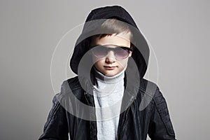 Little boy in hoodie and sunglasses. stylish kid