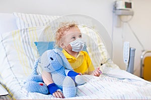 Little boy in hospital room. Virus outbreak