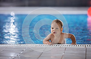 Little boy in indoor swimming pool