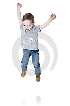 Little boy jumping in the air