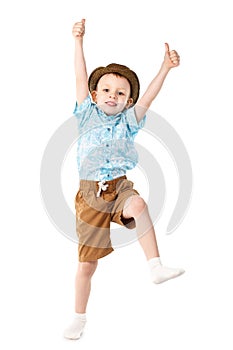 Little boy jumping and having fun isolated on white background.