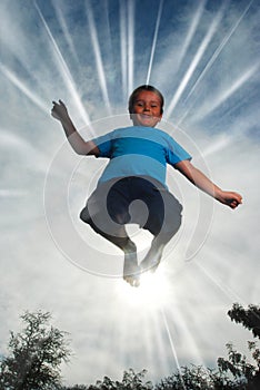 Little boy jumping high