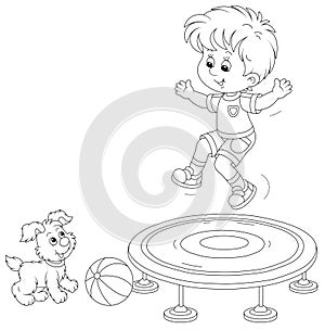 Little boy jumping on a trampoline