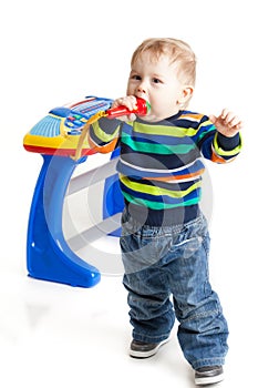 Little boy and the keyboard on white background.