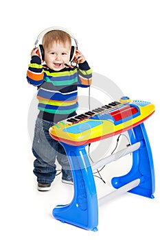 Little boy and the keyboard on white background.