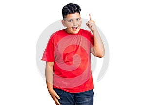 Little boy kid wearing casual clothes pointing finger up with successful idea