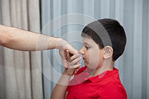 Little boy kiss his father`s hand during Eid mubarak Turkish Ramazan or Seker Bayram