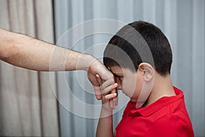 Little boy kiss his father`s hand during Eid mubarak Turkish Ramazan or Seker Bayram.