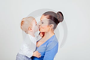 Little boy kisses his mom play show lodon` Kiss