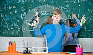 Little boy in lab. Chemistry science. biology experiments with microscope. Little kids earning chemistry in school lab