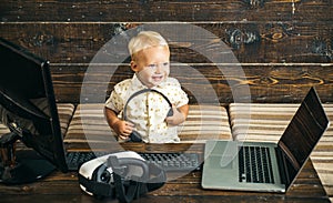 Little boy with laptop computer in room. Laptop user learn new technology. Experience IT