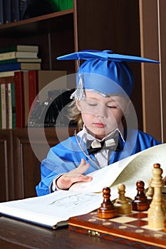 Little boy leafs through a book