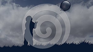 Little boy lets the balloon go to the sky. stationary silhouette of a boy with a balloon against the background of